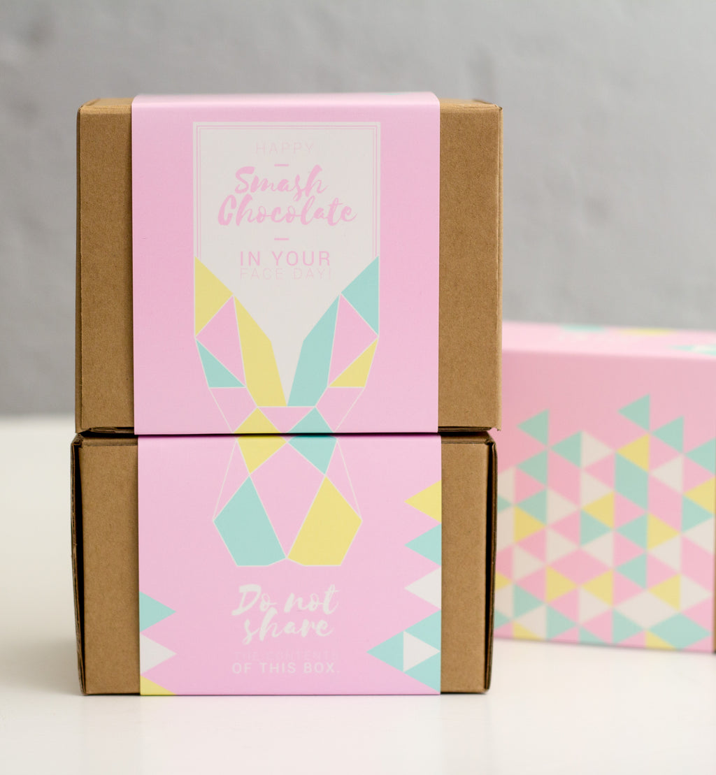 Two pastel coloured gift boxes with an Origami Bunny pattern